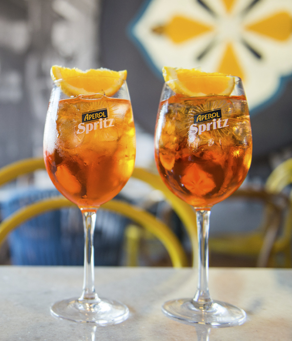 Two glasses cocktails with orange slices