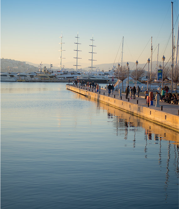People walking on dock at Flisvos Marina,Athens