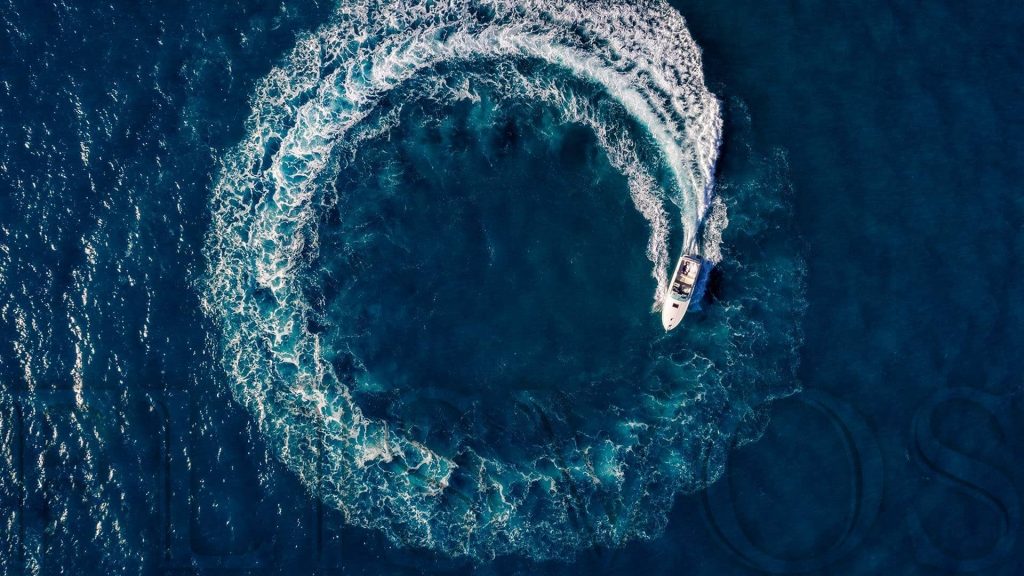 Aerial photograph yacht driving in circle in the sea