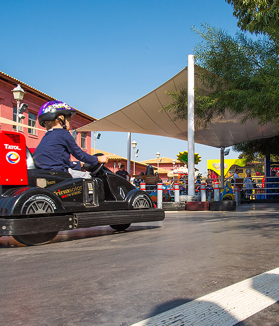 Child in go-kart at Volta Fun Park in Flisvos Marina, Athens