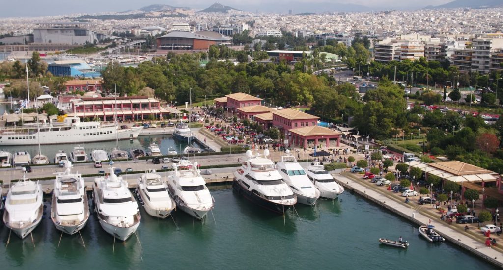 Docked yachts at Flisvos Marina with Athens city in background