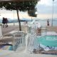 Outdoor table in front of docked yachts at Nisos Restaurant in Flisvos Marina, Athens