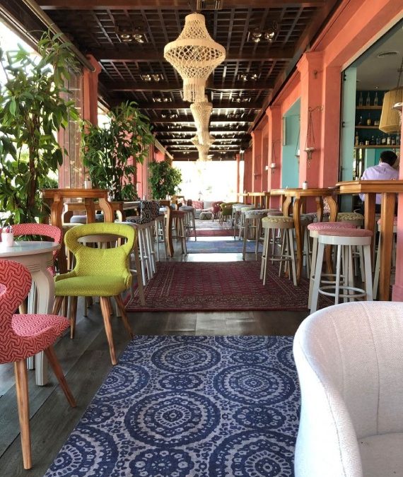 Interior of Boho Sea Life with colorful chairs in Flisvos Marina