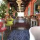 Interior of Boho Sea Life with colorful chairs in Flisvos Marina