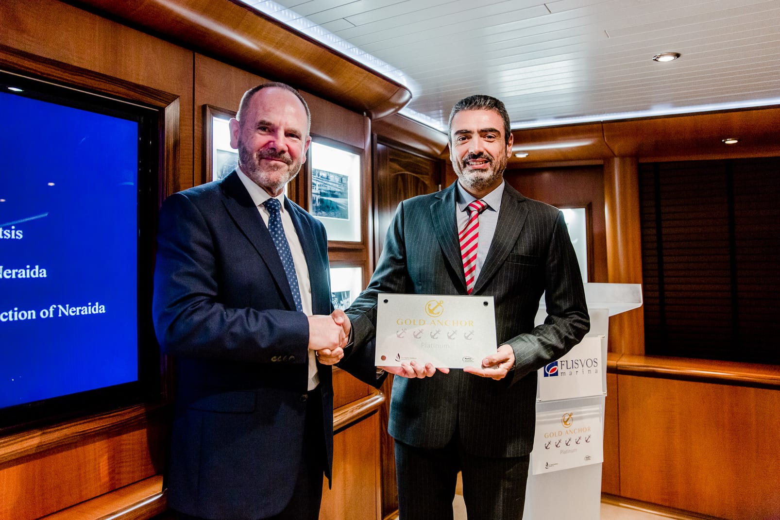 The General Manager of TYHA, Jonathan White delivers the “5 Gold Anchor Platinum” award to the CEO of LAMDA Flisvos Marina S.A., S. Katsikadis 