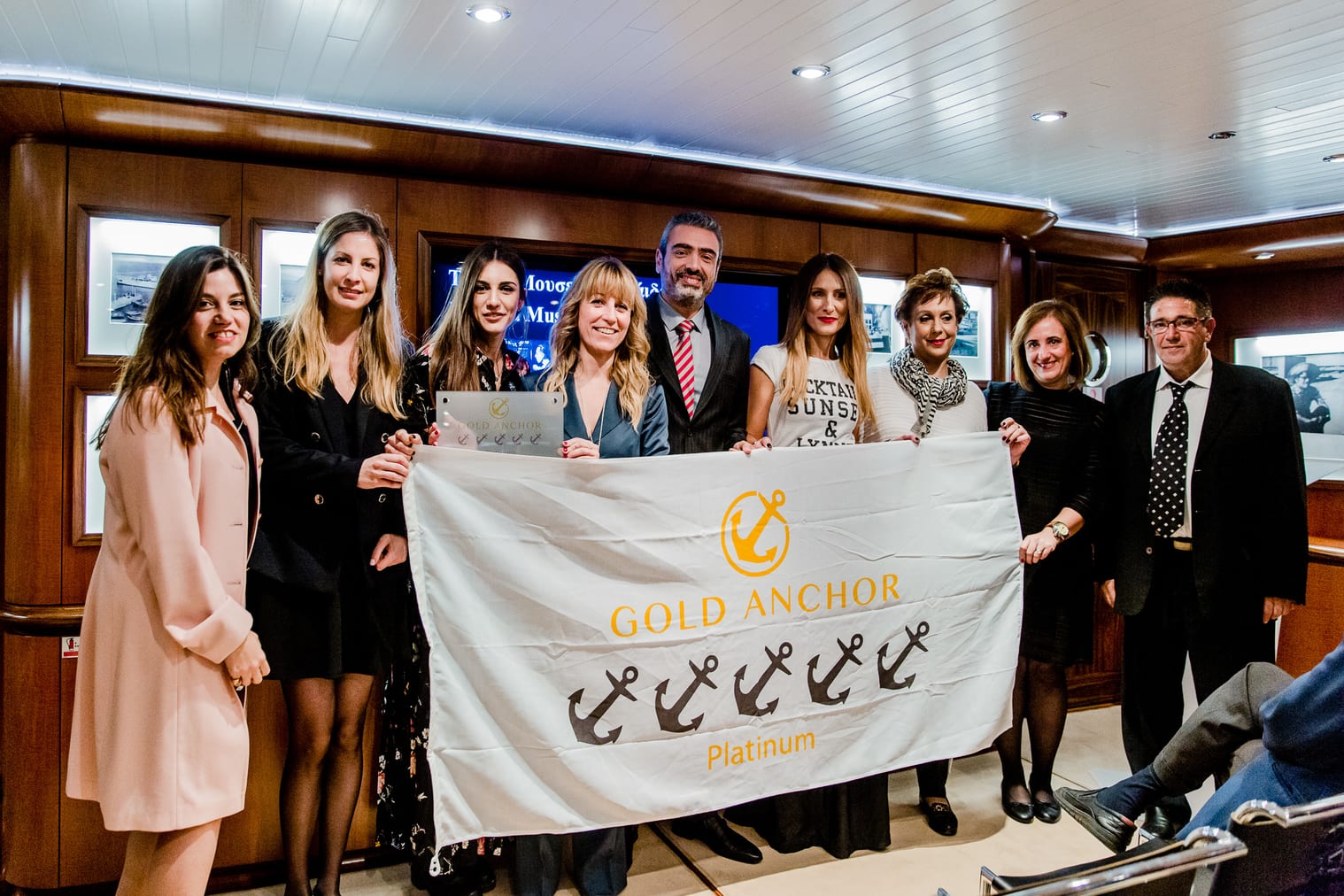 Flisvos Marina's team holding  5 Gold Anchors Platinum flag