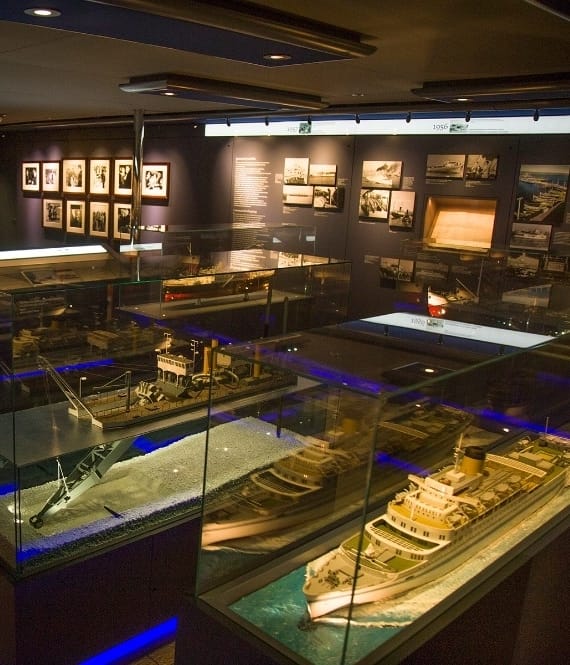 Model ships in glass containers on display in museum