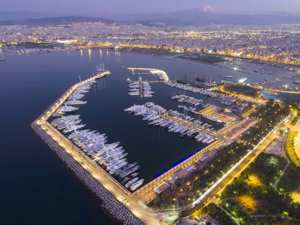 Aerial photograph docked yachts with city in background