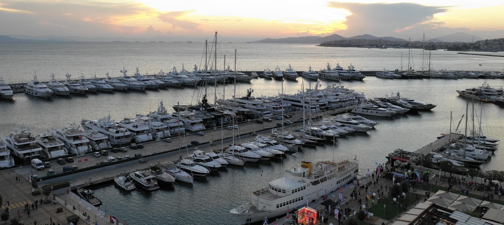 Docked yachts at the marina at sunset