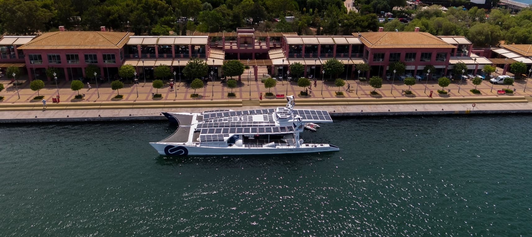 Aerial photograph docked catamaran at Flisvos Marina in Athens promenade