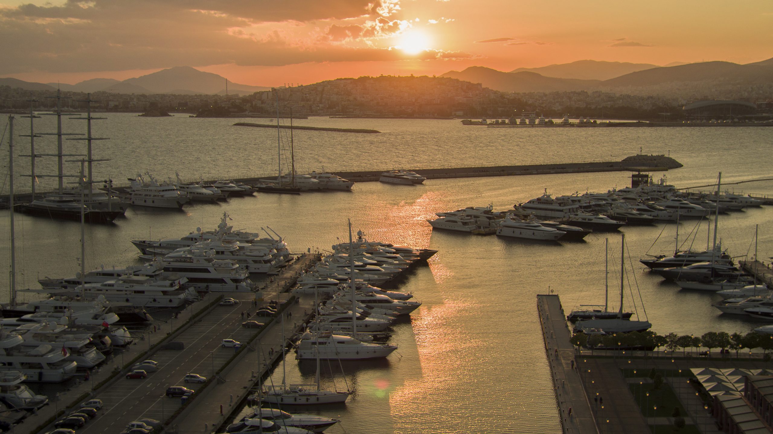 Aerial photograph of docked yachts at sunset in Flisvos Marina in Greece